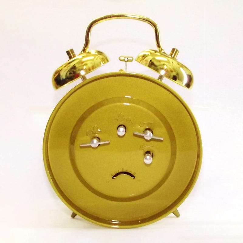 Réveil mécanique doré vintage