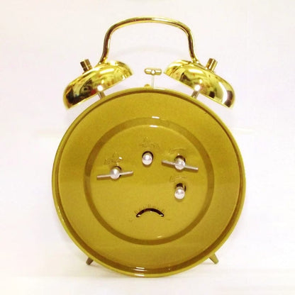 Réveil mécanique doré vintage
